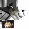 Yozcoffee espresso machine steam wand frothing milk in a stainless steel pitcher for latte art